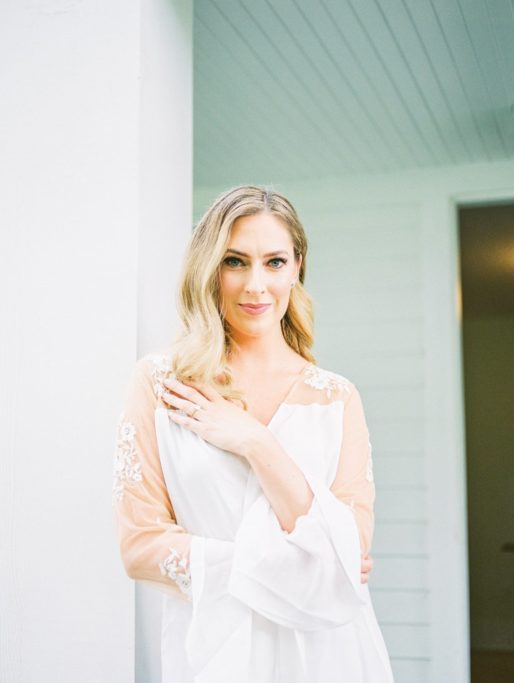 Bridal Portrait of a Bride with Soft Glam Makeup and Loose Curls in a silk robe at a Zingerman's Cornman Farms Wedding | Amarachi Ikeji Photography